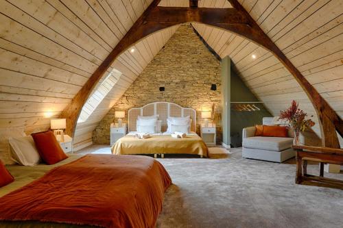 Ένα ή περισσότερα κρεβάτια σε δωμάτιο στο Le gite d'Arthur