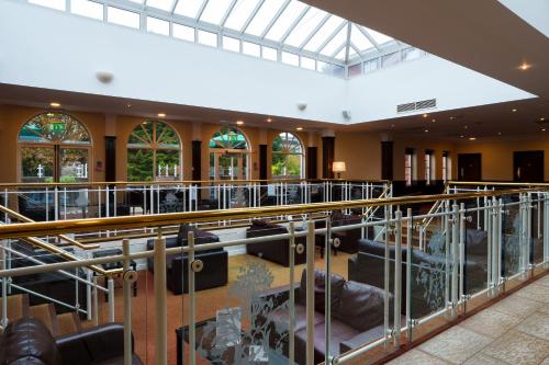 a view of a room with tables and chairs at Arden Hotel And Leisure Club in Bickenhill