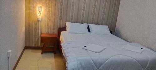 Llit o llits en una habitació de Twilightinn GuestHouse