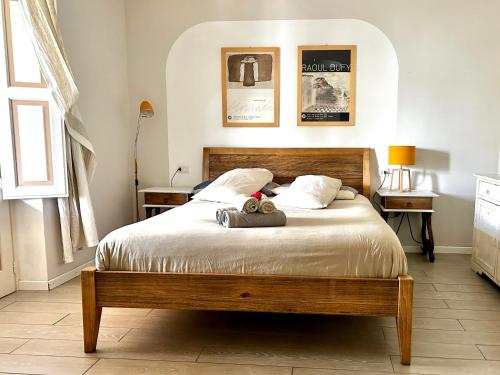 a bedroom with a bed with two stuffed animals on it at Villa Sea Rose in Lipari