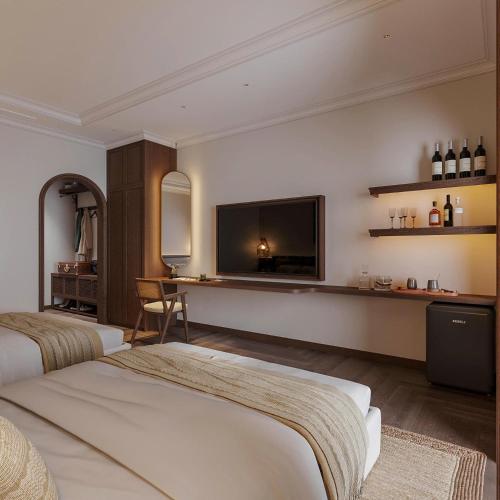 Un dormitorio con dos camas y un televisor de pantalla plana. en Home en Lagom, en Hanói