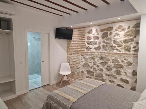 En eller flere senge i et værelse på Casa del siglo XV 3 Privada con Baño