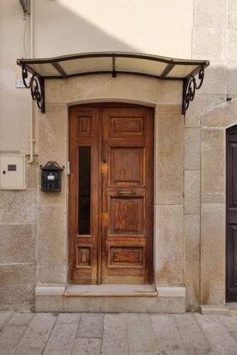 Η πρόσοψη ή η είσοδος του Modern 1st floor apartment with balcony - Casa Berto