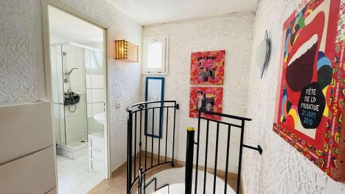 a bathroom with a walk in shower next to a toilet at Appartement Cocody 215 LUMIO in Lumio