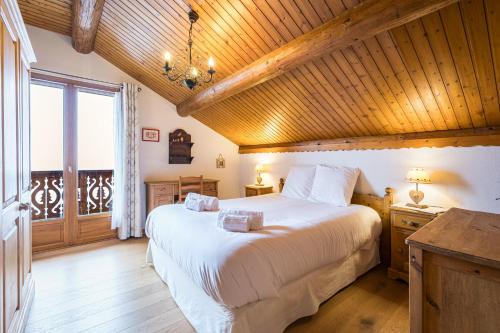 Ένα ή περισσότερα κρεβάτια σε δωμάτιο στο Chalet Le Refuge