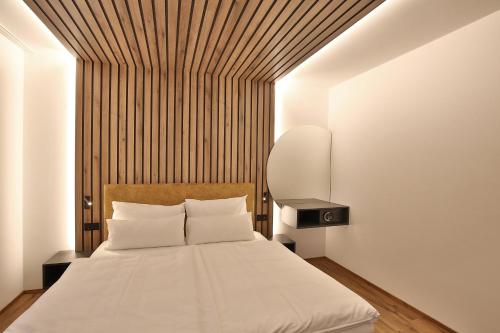 Postel nebo postele na pokoji v ubytování Das Goldjuwel Lifestyle Apartments