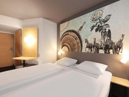 Postel nebo postele na pokoji v ubytování B&B HOTEL Berlin Genshagen-Nord