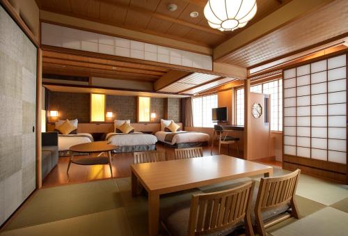 a living room with a couch and a table at ANA Crowne Plaza Hotel Grand Court Nagoya by IHG in Nagoya