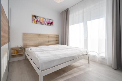 Postel nebo postele na pokoji v ubytování Therme Voyage North Apartment 7