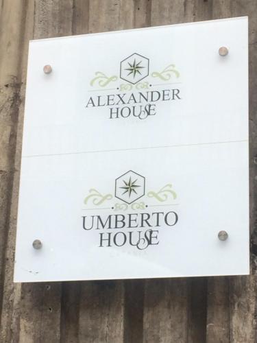 a sign for a alameda house on a wooden fence at Umberto House Catania in Catania
