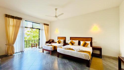 Postel nebo postele na pokoji v ubytování Serenique Resort Kandy