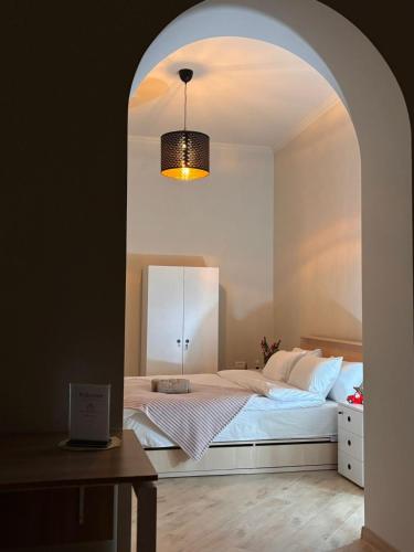 a bedroom with a bed with an archway at Miassine Boutique Hotel in Gyumri