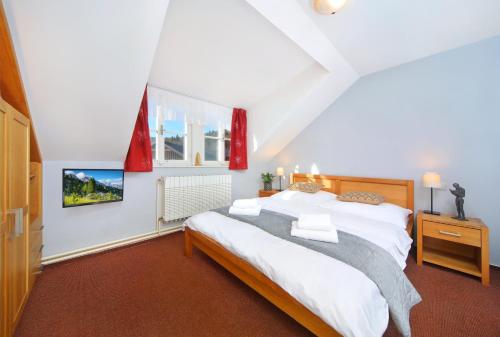 Postel nebo postele na pokoji v ubytování Hotel Erika