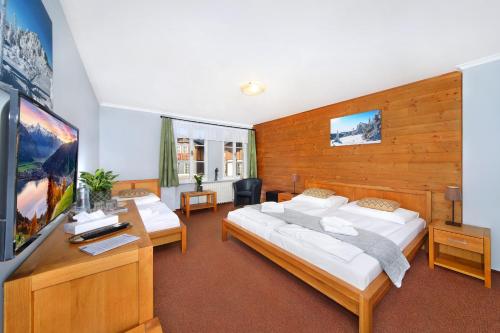 Postel nebo postele na pokoji v ubytování Hotel Erika