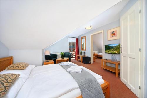 Postel nebo postele na pokoji v ubytování Hotel Erika