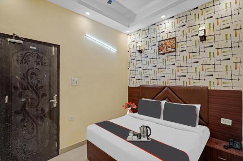 En eller flere senge i et værelse på Hotel O Moon Hotel