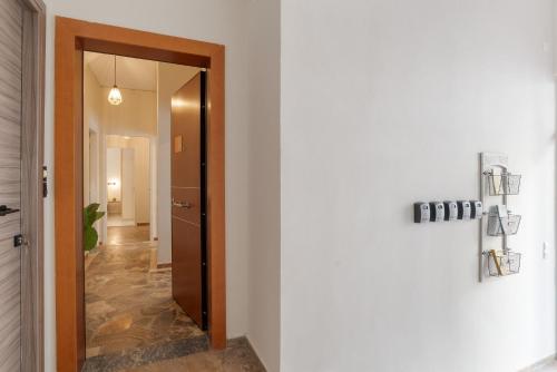 a hallway with a door leading into a room at Chania Experience Residence in Chania