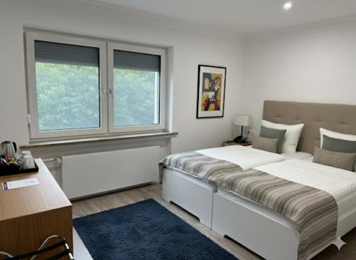 Ένα ή περισσότερα κρεβάτια σε δωμάτιο στο Hotel Aqua