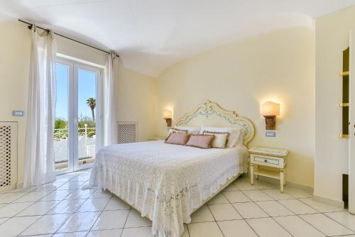 Ένα ή περισσότερα κρεβάτια σε δωμάτιο στο Villa Formica, a due passi dal mare