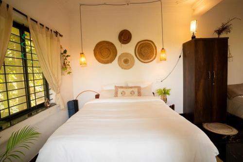 En eller flere senge i et værelse på Barbados Tropical Studio by SiyaU