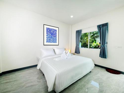 Postel nebo postele na pokoji v ubytování Karon Little House