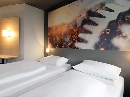 Giường trong phòng chung tại B&B HOTEL Willich