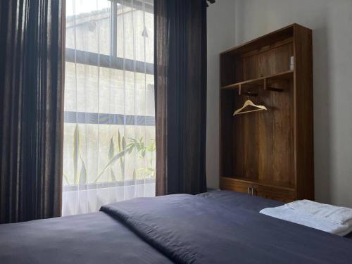 Ένα ή περισσότερα κρεβάτια σε δωμάτιο στο Kali Code Home