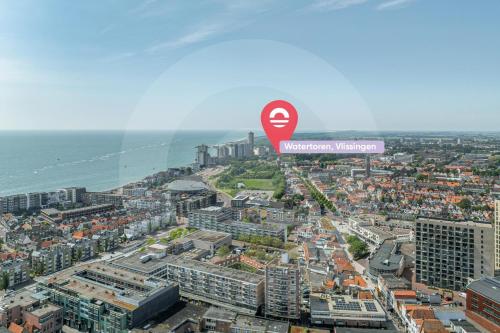 an aerial view of a city with a street sign at Watertoren Vlissingen in Vlissingen