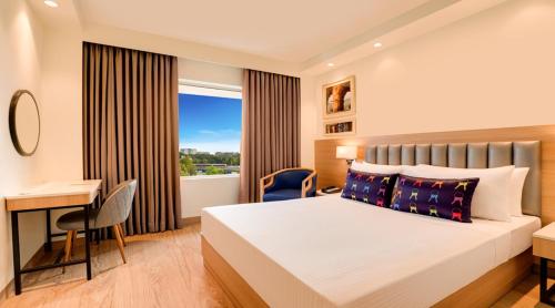 Postel nebo postele na pokoji v ubytování Keys Select by Lemon Tree Hotels, Whitefield, Bengaluru