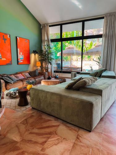 a large bed in a living room with a couch at Villa Balfour in Eilat
