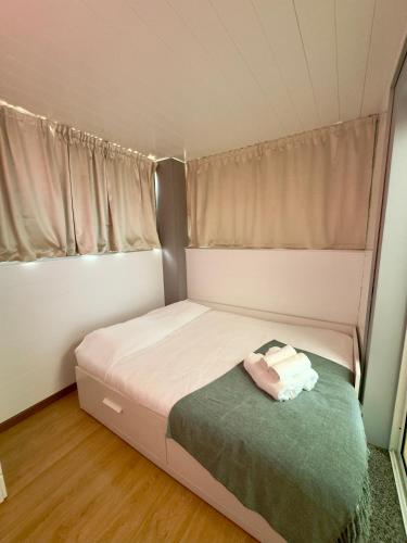 Ένα ή περισσότερα κρεβάτια σε δωμάτιο στο Cantinho da Flor