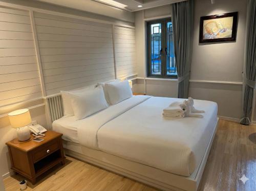 Postel nebo postele na pokoji v ubytování Tuan Hotel Bangkok