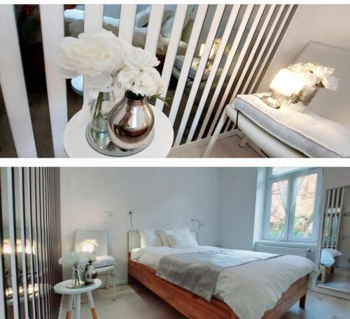 a bedroom with a bed and a vase of flowers at Luxurios and historic apartment "Shine" - right on the Main Square in Zagreb