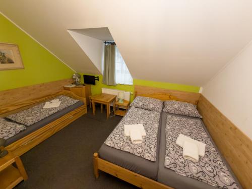 Postel nebo postele na pokoji v ubytování Pension Kadlcuv Mlyn