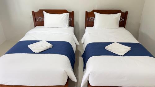 Ένα ή περισσότερα κρεβάτια σε δωμάτιο στο Koh Yao unnrak Resort