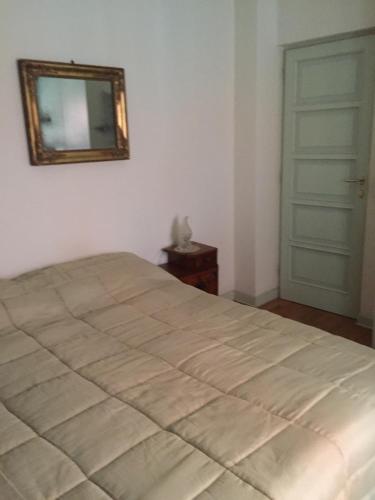 a bedroom with a bed and a mirror on the wall at B&B san Biagio parma in Parma