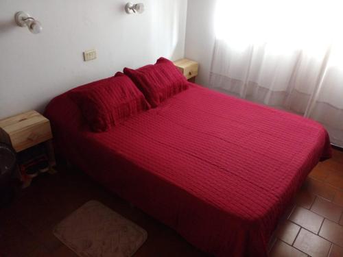 En eller flere senge i et værelse på Duplex N 22 prop Directo en Complejo