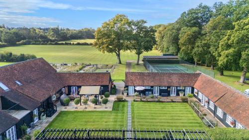 an aerial view of a house with a garden at Whitmoor Farm in Guildford