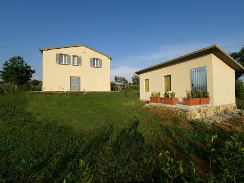 a house on top of a grassy field at Casa di Campagna in Pancole