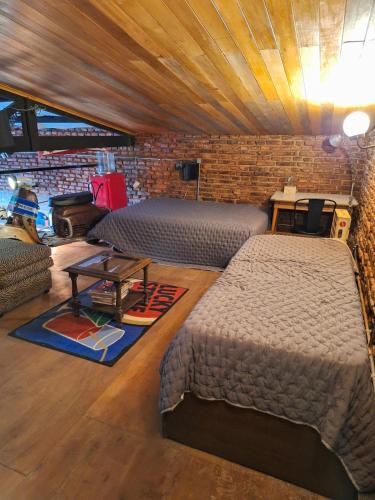 En eller flere senge i et værelse på La Forja Garage