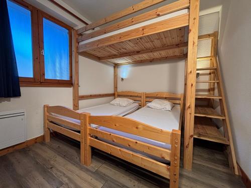 Ένα ή περισσότερα κρεβάτια σε δωμάτιο στο Résidence Saboia Clés Blanches