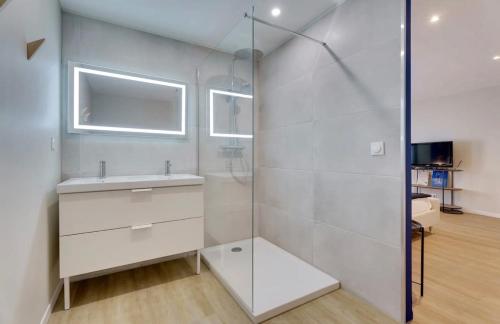 a bathroom with a sink and a shower at Maison avec espace bien-être privé in Mareuil-sur-Lay