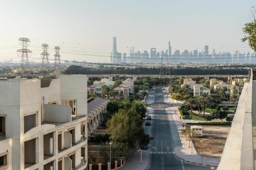 a view of a city street with a building at Samaya Holiday Homes - Cloud Stylish Suites with Balcony in Dubai