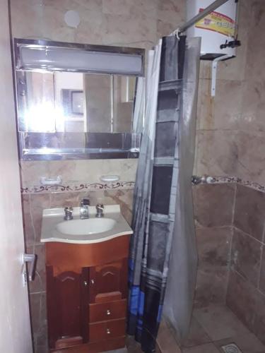 a bathroom with a sink and a shower at Sueño magico in Chapadmalal