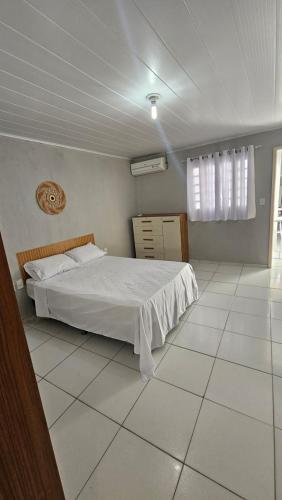 Postel nebo postele na pokoji v ubytování Casa por temporada em Penedo