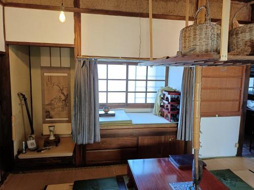 Postel nebo postele na pokoji v ubytování みぃちゃの家 Casa di Micia はなれ