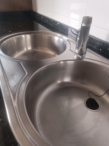 a stainless steel sink with a faucet at Orio San Sebastian 4 habitaciones plazas in Orio