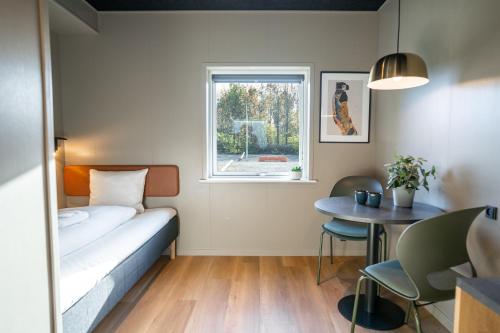 Postel nebo postele na pokoji v ubytování MyHotel Taastrup