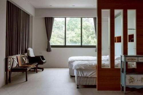 Ένα ή περισσότερα κρεβάτια σε δωμάτιο στο A Shin Tainan Hostel