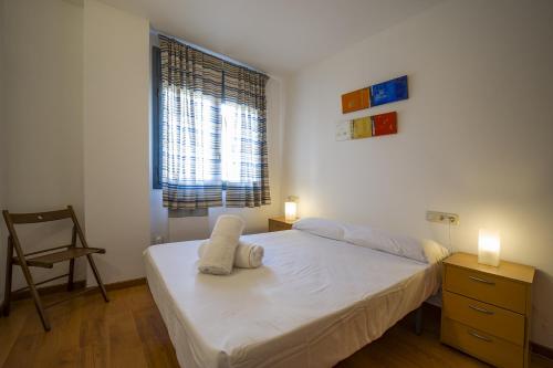 Ένα ή περισσότερα κρεβάτια σε δωμάτιο στο Acogedor apartamento vacacional en La Molina - Alp